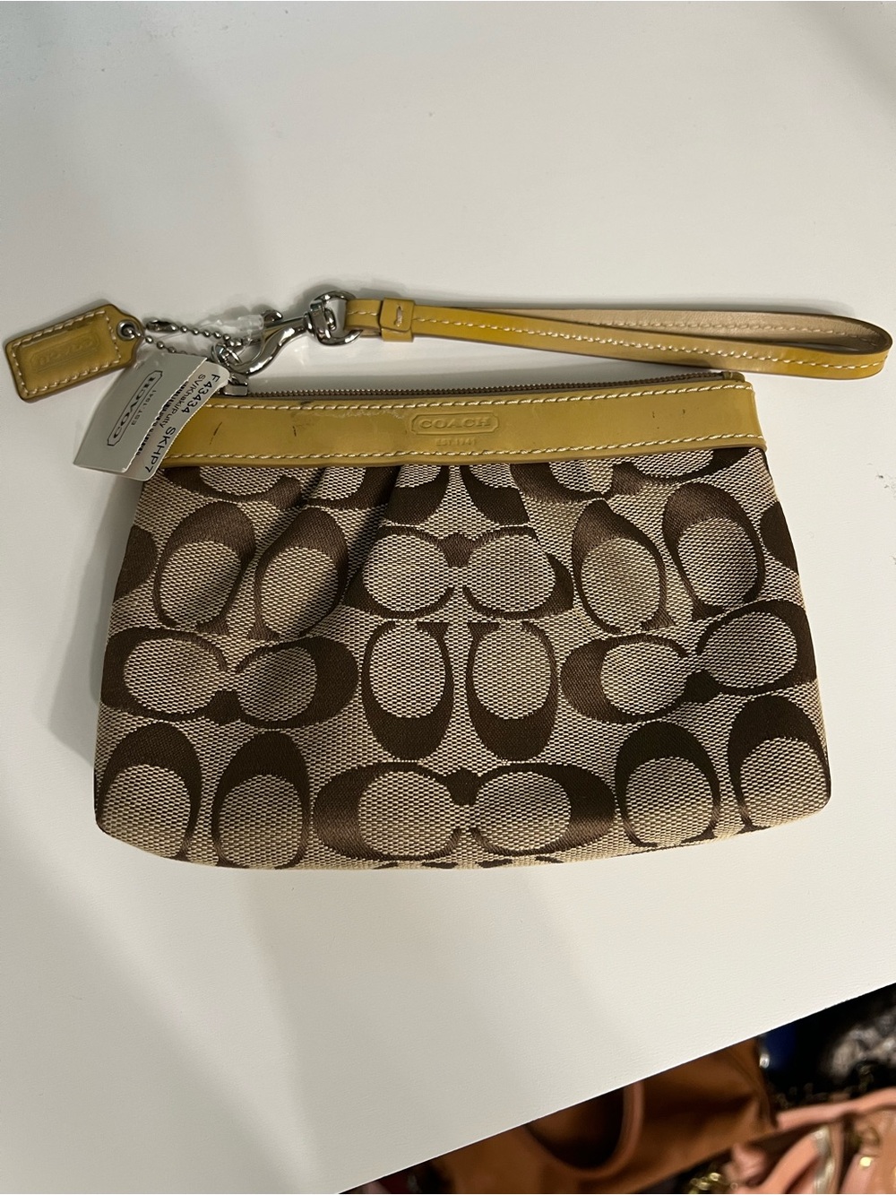 Coach Brown and putty color signature Canvas Wristlet